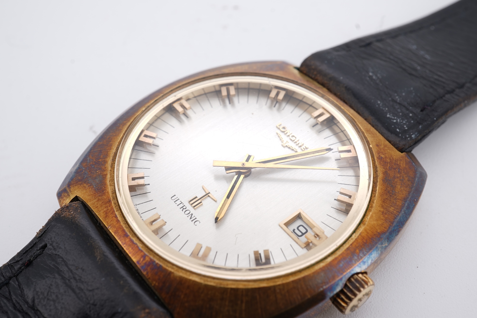 A gentleman's circa 1970'sstell and gilt Longines Ultronic quartz wrist watch, with block numerals and date aperture, movement c. 6312, case diameter 40mm, on an associated leather strap, np box or papers.